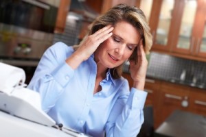 Woman having headache migraine. Stress and depression.